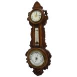 Clock and aneroid barometer with thermometer, within a foliate carved oak case, 25.5" high