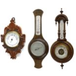 Small aneroid wall barometer, the 5" white dial within a lozenge shaped foliate carved oak case, 14"