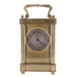 Carriage clock timepiece, the 1.75" silvered chapter ring enclosing an engine turned centre and