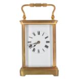 Carriage clock striking on a gong, within a corniche gilded brass case, 6.25" high (winding key)