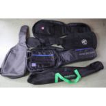 Four guitar soft bags; together with a K & M stand bag