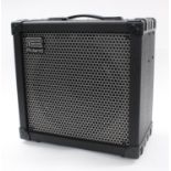 Roland Cube 80X guitar amplifier, made in China, ser. no. ZY05344, with dust cover