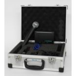 Shure SM58 dynamic wireless microphone and receiver, within a fitted flight case