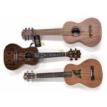 Two contemporary ukuleles by and labelled Eddy Finn, model EF-15-T and Black Water model no. YWUK-
