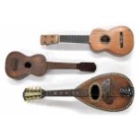Old ukulele bearing the trademark label of Jose Alvares, case; also another old ukulele,