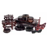 Selection of assorted Chinese hardwood plate/pot stands, the largest rectangular example 15.75"