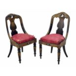 Pair of attractive Victorian ebonised and gilt papier maché salon chairs, a shaped back over figural