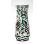 Poole Pottery vase, scrolling foliate decorated in green and burgundy, signed K. Hickisson and