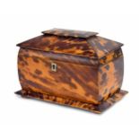 Victorian tortoiseshell tea caddy of sarcophagus form, with a hinged cover enclosing a divided