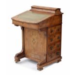 Victorian figured walnut Davenport, the raised back with hinged cover enclosing stationery