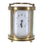 French carriage clock timepiece, within an oval brass case, 6.25" high (key)