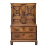 Interesting Continental chest on stand of small proportion, the moulded top over two carved panelled