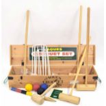 Jaques croquet set, with four labelled English ash mallets, four balls, hoops and stake, contained