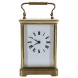 Carriage clock timepiece striking on a gong, within a corniche brass case, 6" high (key)