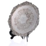 Large cast silver plated circular tray, with scrolling foliate moulded rim and presentation