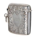 Edwardian silver vesta case, with foliate engraved decorated around a shaped cartouche inscribed '