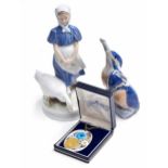 Royal Copenhagen - porcelain figure of a girl and swan, model no. 527, factory stamp and numbered to