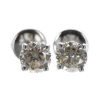 Pair of 18ct white gold claw-set diamond stud earrings, round brilliant-cut, 1.20ct approx in total,