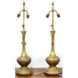 Pair of decorative Moorish style brass table lamps, with twin bulb fittings and repousse bases,