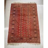 Afghan pattern orange ground rug, 57" x 38"