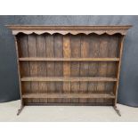 Oak dresser back with moulded cornice over a way frieze and three plate shelves, 55.5" wide, 12"