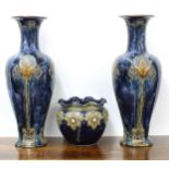 Royal Doulton - a large pair of baluster vases, decorated with stylised flowers on a mottled blue
