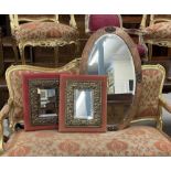 Arts and Crafts style hammered copper oval wall mirror, 33" x 20"; together with two further mirrors