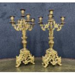 Decorative pair of French gilt metal candelabra, with scrolling pierced supports and trefoil