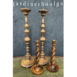 Pair of turned oak altar pricket candlesticks, 23.5" high; together with a pair of barley twist