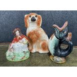 Staffordshire pottery dog figure, 11.5" high; together with a Staffordshire figure of Red Riding