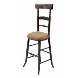 Victorian child's correction chair, the carved bar back on turned supports over a stuff over