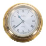 Celeste British made brass bulkhead type clock, with an 8 day lever movement, 90mm diameter