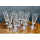 A good selection of antique and later glass to include nine tall ale lens facet cut glasses