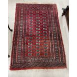 Bokhara pattern red ground rug, 75" x 50"