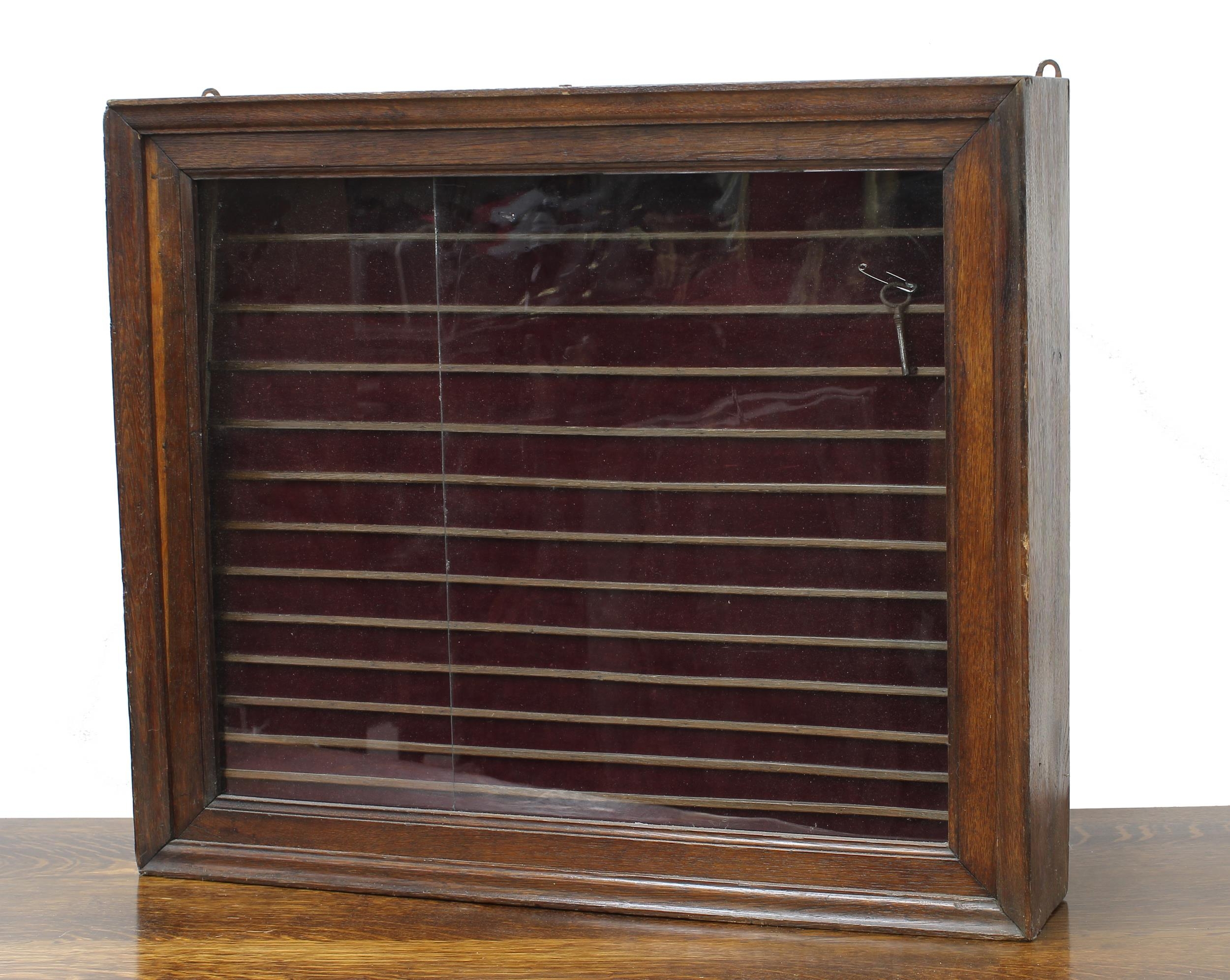 Oak collectors display cabinet, the slide glazed front with tiered lined interior, 26" wide, 4.5"