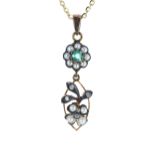 Pretty emerald, diamond and seed pearl floral drop pendant, on a silver-gilt chain, the pendant