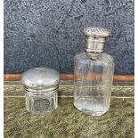 Two Victorian silver topped glass dressing table bottles, tallest 3.75" high (2)