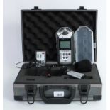 Zoom H4N Handy Recorder, with protective plastic case, fitted within a flight case enclosing a