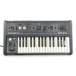 Roland SH-09 Synthesizer keyboard, made in Japan, ser. no. 107658, within a Novation gig bag