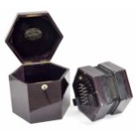 Good Lachenal & Co English concertina with forty-eight metal buttons on rosewood ends, with five-