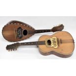 Neapolitan mandolin indistinctly labelled and dated Anno 1900; also another guitar shaped mandolin