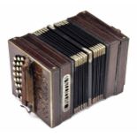 Old rosewood German concertina in need of restoration, with forty-four buttons on foliate pierced