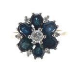 18ct sapphire and diamond cluster ring, with six oval sapphires around a centre diamond 0.10ct