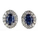 Pretty pair of 18ct white gold oval sapphire and round brilliant-cut diamond cluster stud
