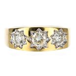 Good 9ct yellow gold three stone star effect gypsy ring, set with round brilliant cut diamonds,