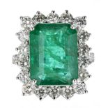 Fine and impressive18ct white gold large emerald-cut emerald and diamond cluster ring with diamond