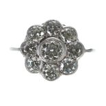 Attractive platinum diamond daisy cluster ring, with nine round brilliant-cut diamonds, estimated