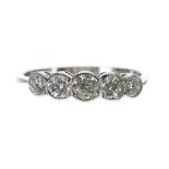 Platinum five stone diamond ring in a rub-over setting, round brilliant-cut, 0.70ct approx,