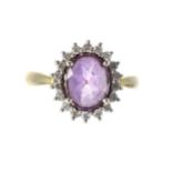 18ct amethyst and diamond oval cluster ring, the amethyst 1.50ct approx, in a surround of