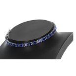 Good modern 18ct white gold oval sapphire line bracelet, estimated 10.87ct approx in total, width